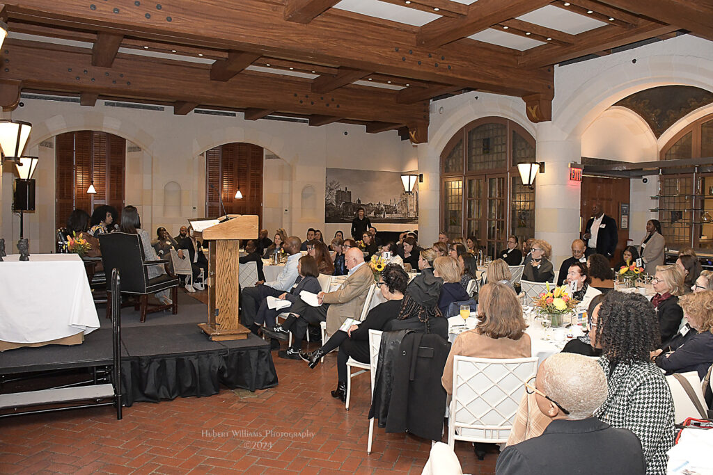 Crowd listens to panel at Our Voices Ourselves 2024